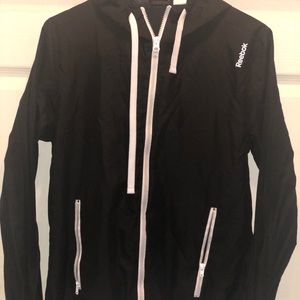 Black Reebok jacket.